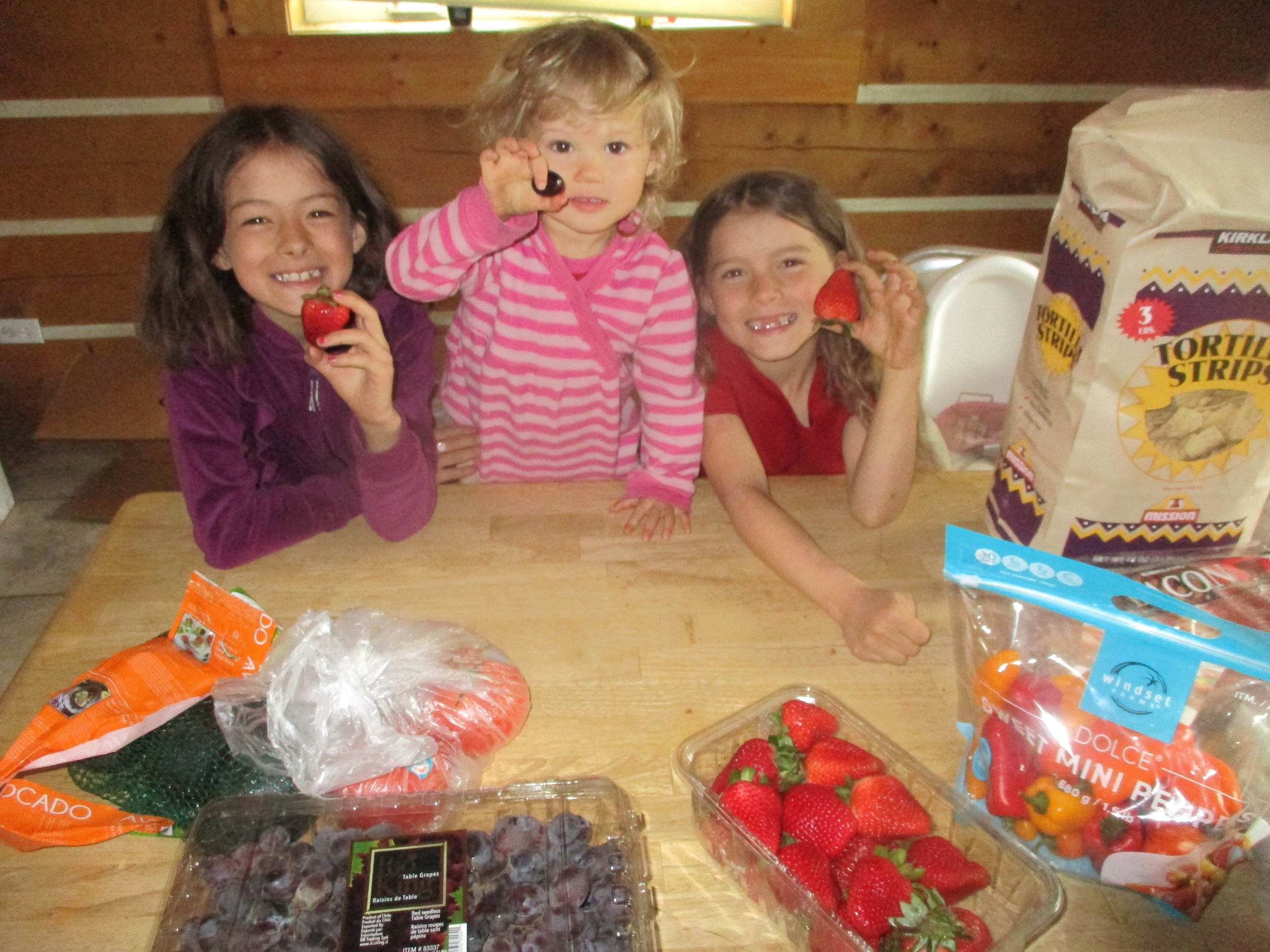 Happy Children with fresh groceries during the COVID crisis.
