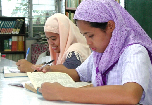Tutor teach Muslim students in Southeast Asia